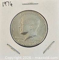 Obverse of 1976 Kennedy half dollar in cardboard flip