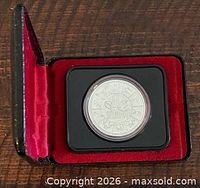Coin in open presentation case