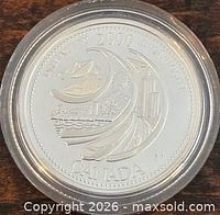 Reverse of 2000 Canada "Ingenuity" silver proof quarter in capsule
