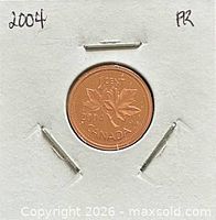 Full view of coin in cardboard flip with date notation