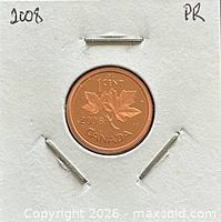 Reverse showing maple leaf design and 2008 date in cardboard flip