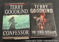 Front covers of both hardcover novels showing titles and author name