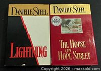 Front covers of both hardcover novels