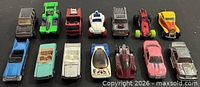 All fourteen Hot Wheels vehicles arrayed in two rows