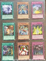 Front view of all nine cards in binder sleeve