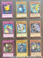 Front view of nine Yu-Gi-Oh! cards in binder page
