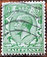 Front of green King George V ½d stamp showing design and cancellation