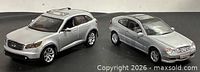 Mercedes-Benz C-Class Sports Coupe and Infiniti FX45 die-cast cars side by side