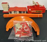 Overall lot showing Rod Runner, building, tower, curved track, bag of supports, bundled straight tracks