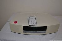 Front top view of Bose Wave Radio/CD player with remote on top