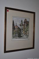 Framed lithograph angled view showing frame and mat