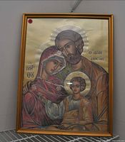 Full view of framed Holy Family icon with gold frame and gilded background