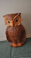 Front view of large painted ceramic owl umbrella stand