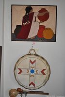 Overall lot view showing textile art and drum