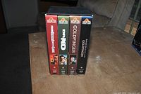 Front spines of four MGM/UA James Bond VHS tapes standing upright