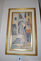 Front view of framed vertical cityscape painting signed Bevort