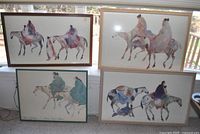 All four framed prints displayed together