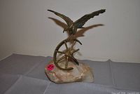 Overall view of brass eagle figurine on onyx base