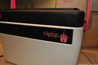 Front left view showing cooler body, lid texture and logo decal