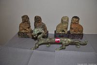 Group view: bronze dragon front, four stone foo dogs rear