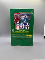 Front of sealed 1990 Pro Set NFL Football card box showing branding, player images and shrink wrap