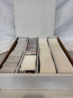 Open three-row long box showing rows of hockey cards