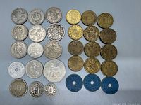 All items laid out showing obverse designs and relative sizes