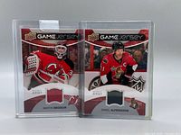 Front view showing both game jersey cards in holders