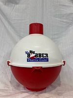 Front view of spherical red and white Big Bobber Floating Cooler