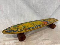 Top view of skateboard showing graphic and wheels