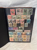 Album page with early to mid-century Vatican stamps in clear sleeves