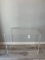 Front view of clear plexiglass table