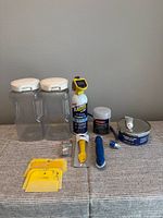 overall lot showing Snapware containers and assorted automotive items