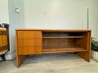 Front view showing drawers and open shelving