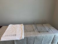 Overview of laundry bag and two wire baskets