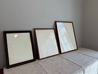 three frames front view on table