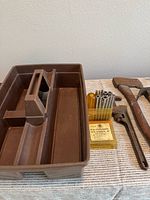 Carrier tray with driver bit set, adjustable wrench, hammer handles visible