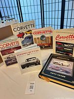 All six Corvette books displayed upright and flat to show covers