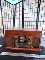 Front view of Crosley CR245 console showing control panel and speaker grilles