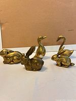 group shot of all brass figurines showing size and finish