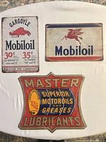 All three metal signs laid out together