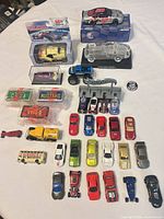 Group shot of all cars including boxed models, crystal Corvette, loose cars and accessories