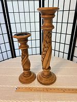Front view of both candlesticks side by side on table