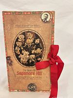 Front of decorative presentation box showing collection title and commemorative medallion