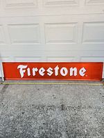 Full view of Firestone sign front showing color, logo and overall condition