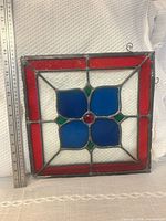 front view of stained glass panel showing full design and size reference