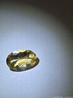 Front view of oval golden Helidor gemstone