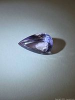 Pear-cut amethyst front view showing facets and color