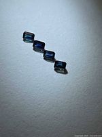 four rectangular blue sapphires