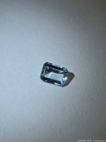 Front view of emerald-cut aquamarine showing color and clarity